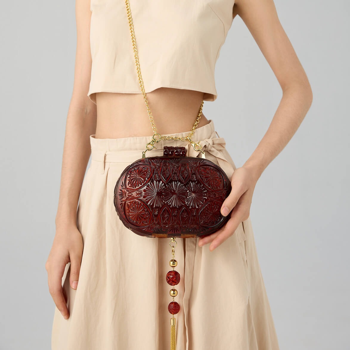 Hand Carved Oval Clutch Amber