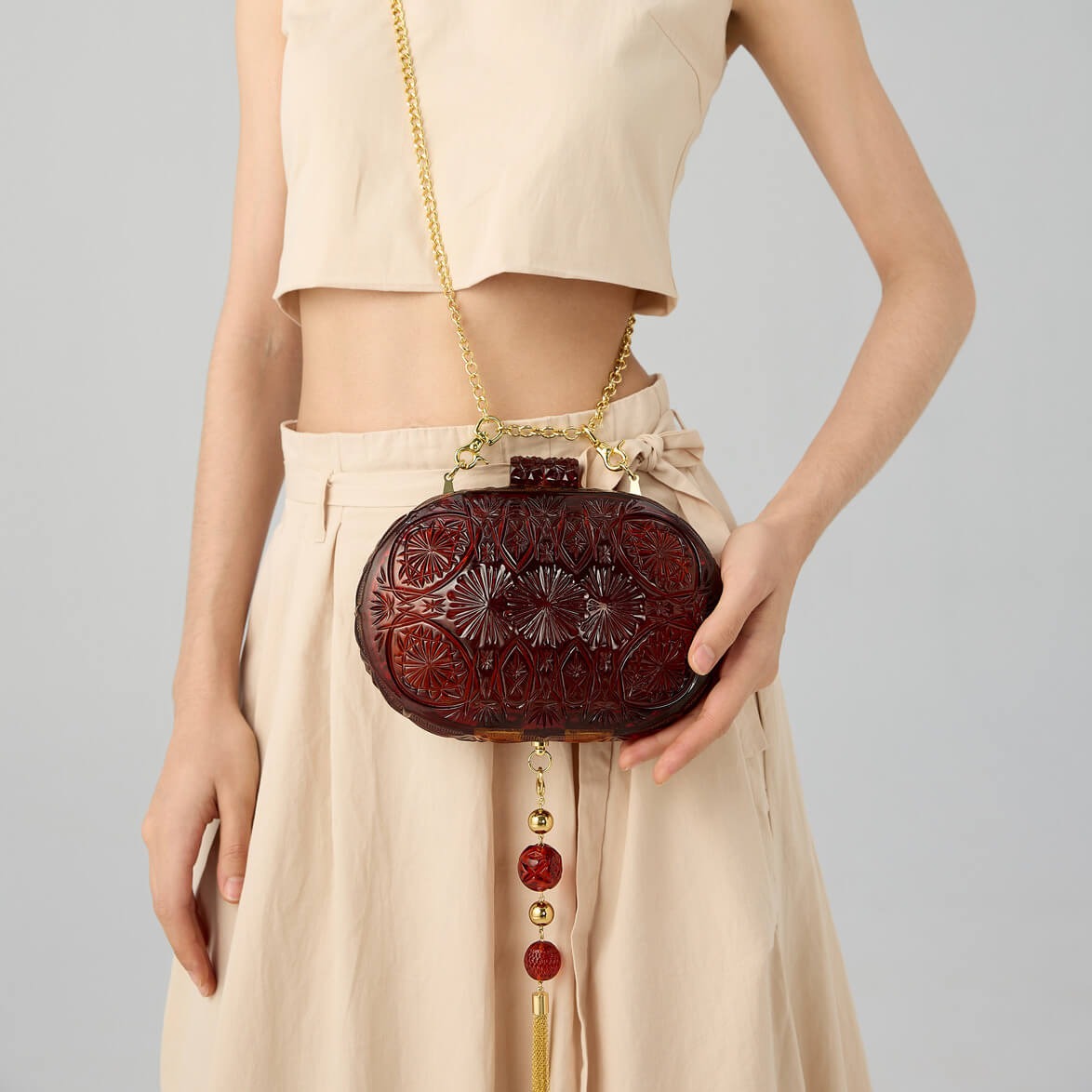 NEW IN Intricate Oval Clutch Amber