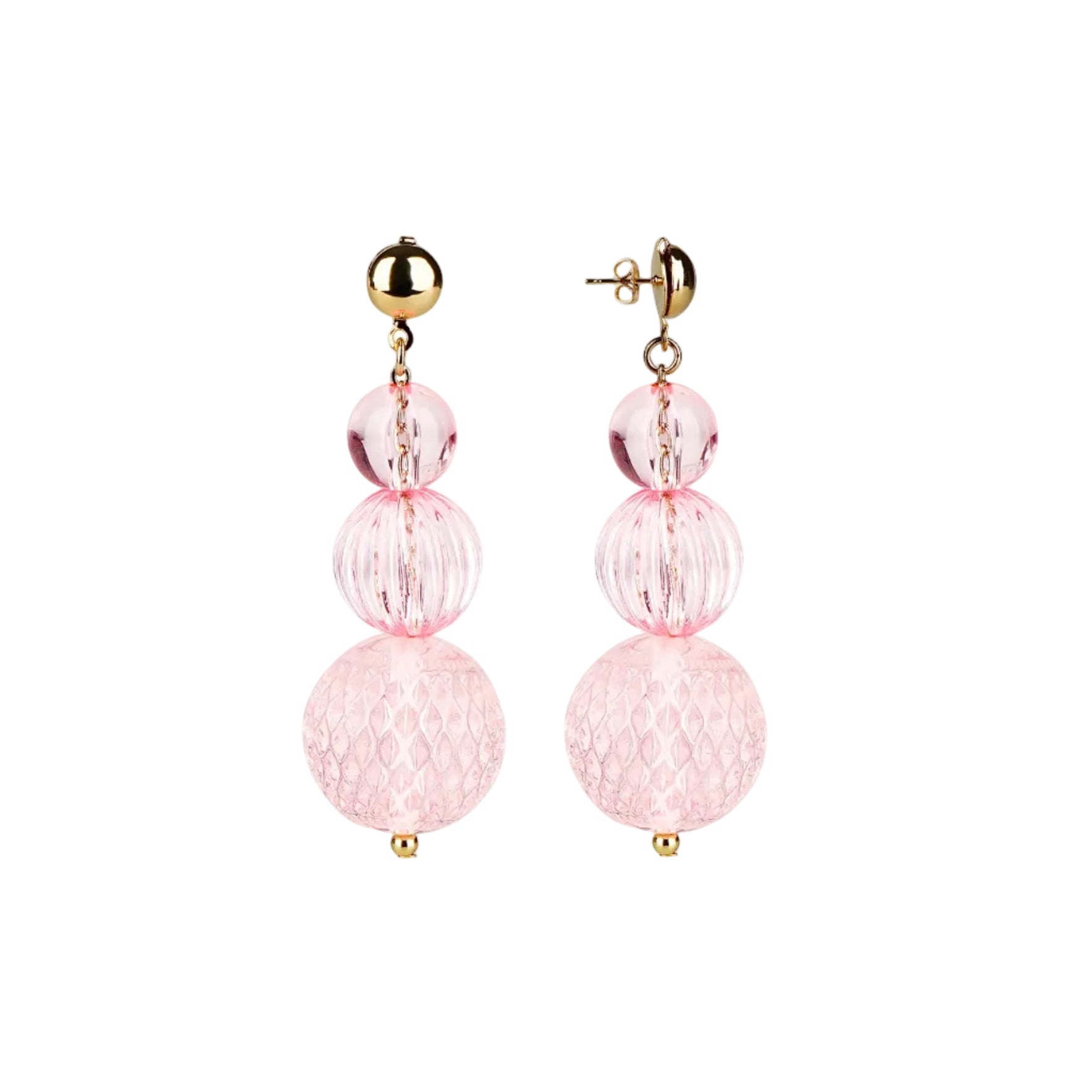 A pair of gold and light pink drop earrings with three stacked textured glass beads of varying sizes on a solid white background.