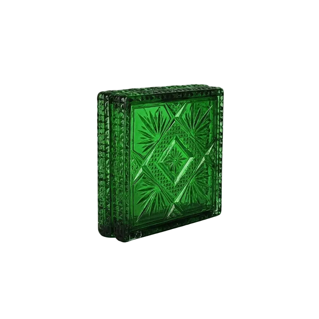 A green cut-glass inspired box clutch with an embossed geometric diamond pattern and a textured beaded border, shown on a plain white background.