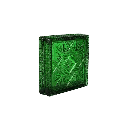 A green cut-glass inspired box clutch with an embossed geometric diamond pattern and a textured beaded border, shown on a plain white background.