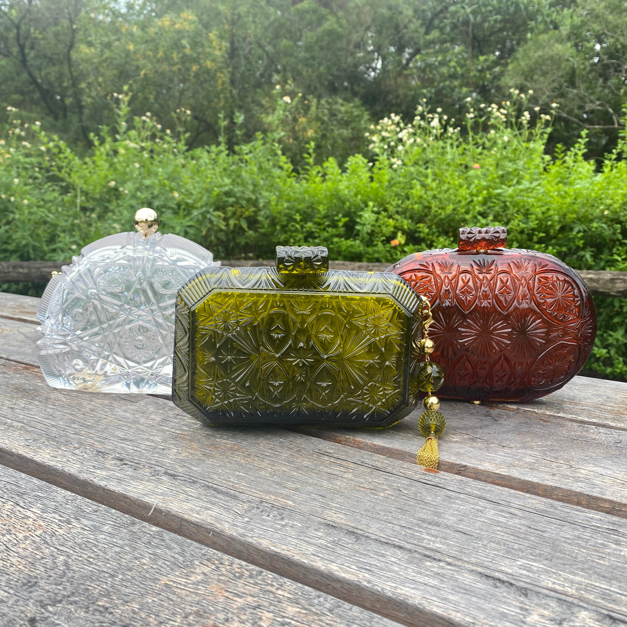 elegant resin clutch bags with intricate handcarved patterns outdoor