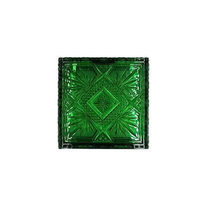 A square green glass plate with an embossed geometric starburst pattern, shown from a top-down view on a white background.