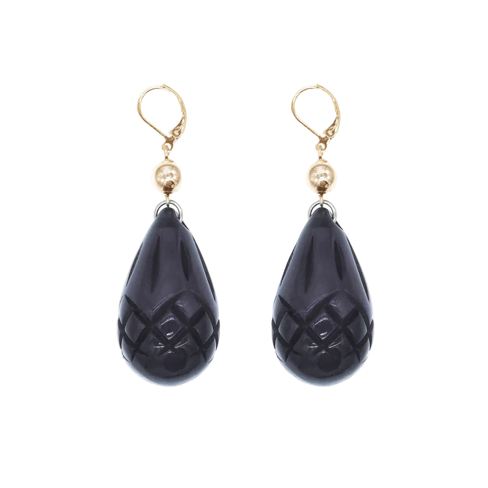 A pair of teardrop-shaped drop earrings featuring carved dark black onyx pomegranate beads with a gold leverback hook and a small gold bead accent.