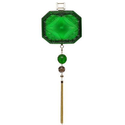 A green cut-glass inspired clutch bag featuring a faceted octagonal top, a hanging tassel, and decorative beads, shown against a plain white background.