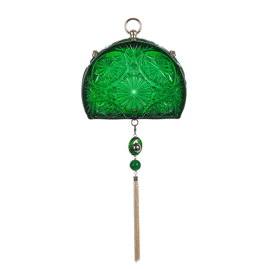 A half circled shaped green cut-glass clutch purse with a hanging tassel and green bead accents, shown against a plain white background.